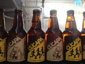 Bottles of beer from Cucapa Brewing Co. of Mexicali, one of the first microbreweries in Baja California, line a shelf at the Street Food Market party held March 24, 2013 in the San Diego Public Market. (Photo by Cyndia Zwahlen for the Small Biz Mix)